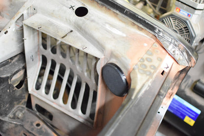 Fresh air intake blanking plate fitted to a Classic Mini Clubman inner wing