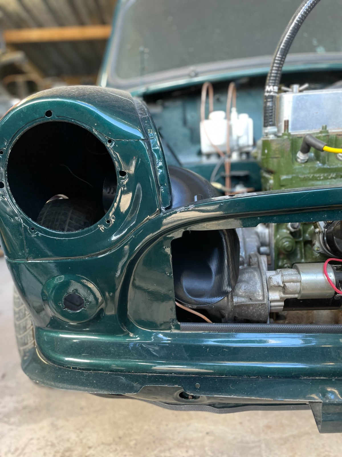 Classic Mini roundnose fresh air scoop visible through the front grille opening